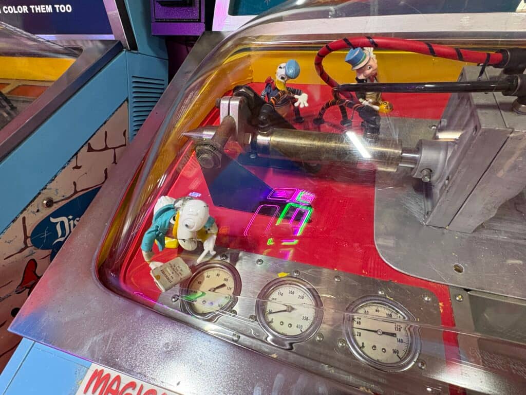 Old arcade machine with colorful controls micromold machine