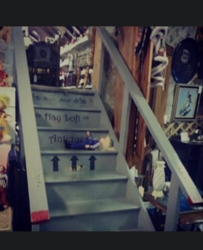 Stairs with antique decor and spooky doll